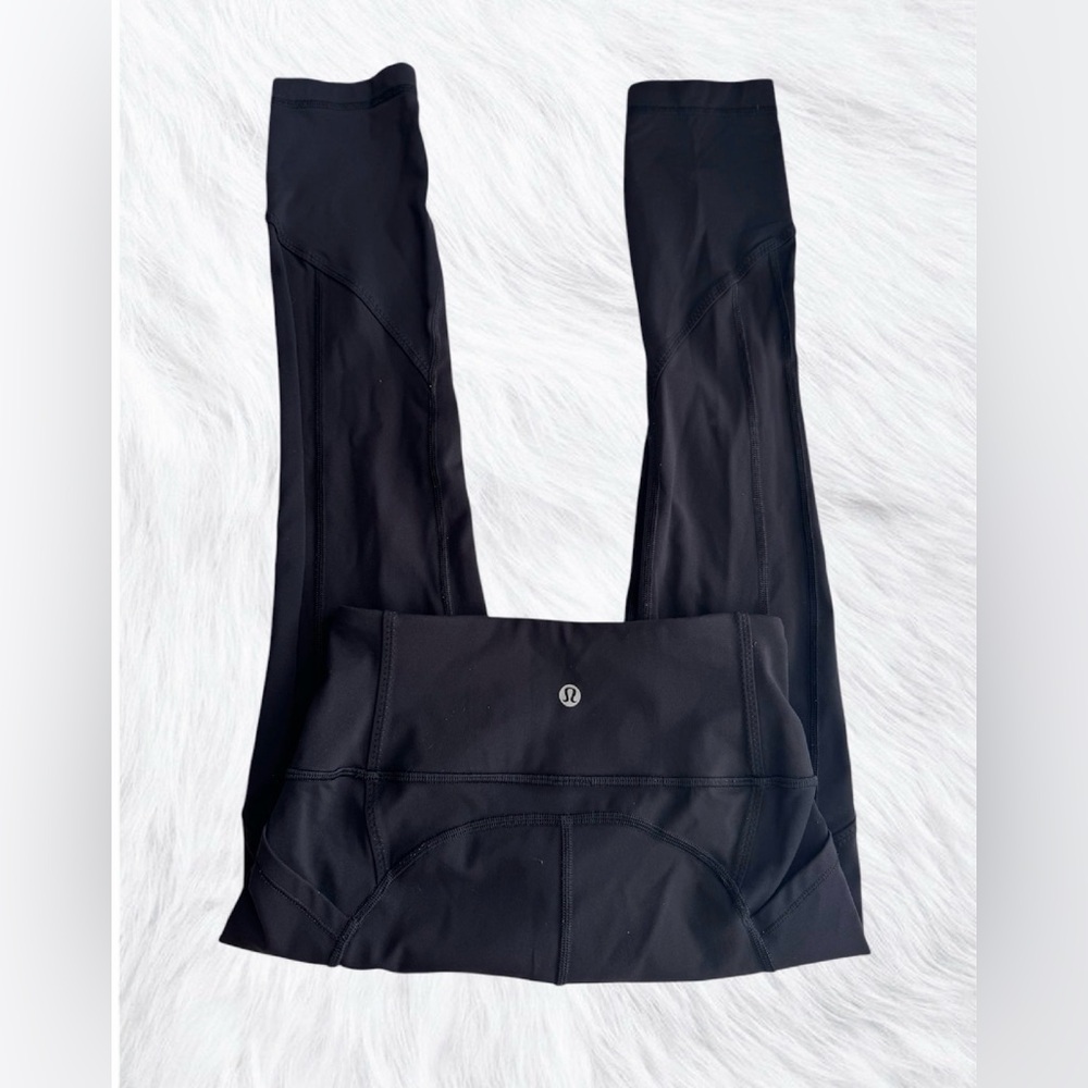 Lululemon Black high rise leggings pockets* 23” size 4